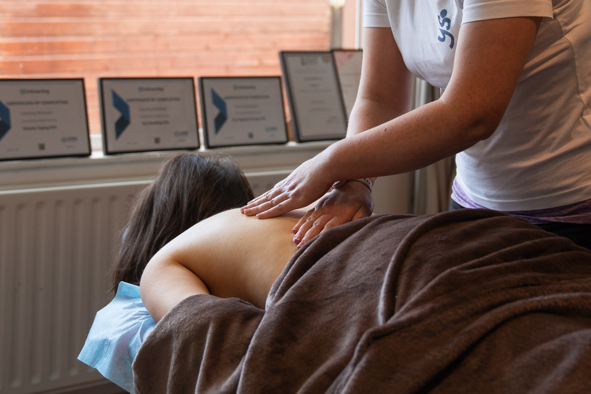 A woman giving a sports massage