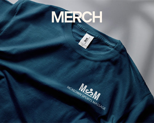 A blue branded t shirt on a countertop. The title says, Merch.